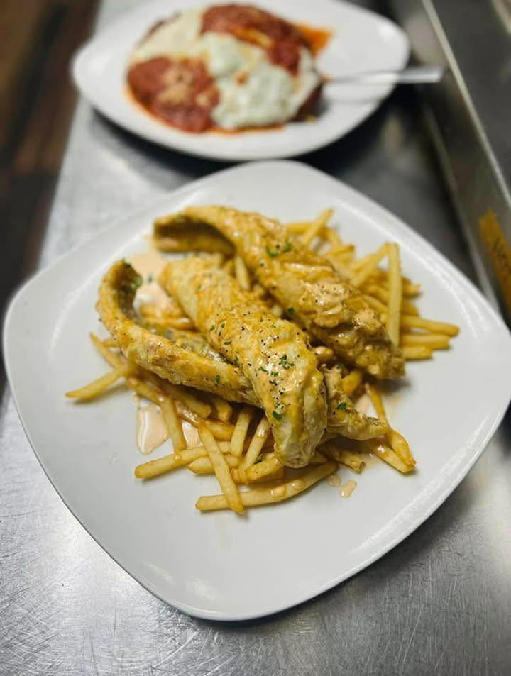 Lake Perch: Lightly battered and fried lake Perch topped with lemon aioli and served with shoestring french fries