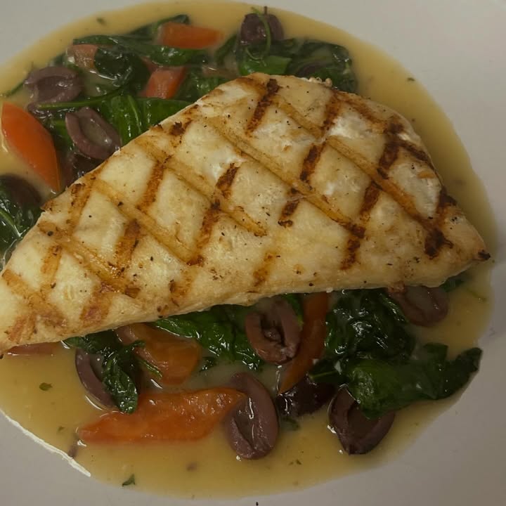Chargrilled Snapper with a butter sauce tomatoes, Kalamata olives, and spinach-yummy!!